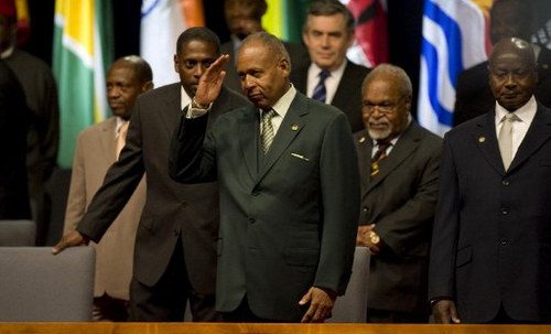 Photo: Late Trinidad and Tobago Prime Minister Patrick Augustus Mervyn Manning (centre) waves during the opening ceremony of the Commonwealth Heads of Government Meeting in Port of Spain, Trinidad and Tobago, on 27 November 2009. (Copyright AFP 2016/Luis Acosta)