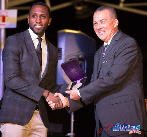 Photo: Trinidad and Tobago track star Richard Thompson (left) poses with President Anthony Carmona at a ceremony in The Anchorage, Carenage on 29 June 2016. (Courtesy Allan V Crane/CA Images/Wired868)