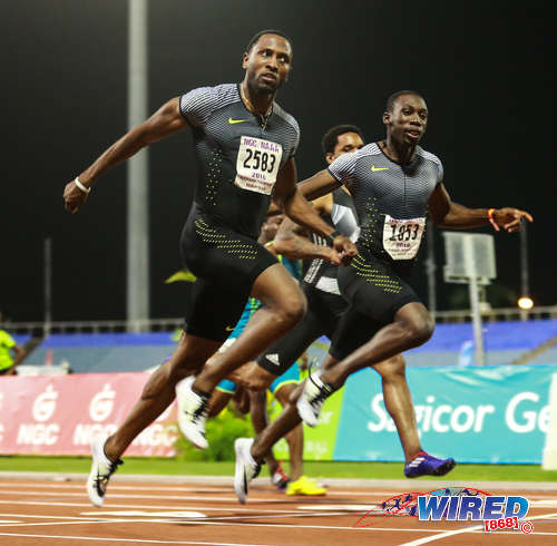 Photo: Trinidad and Tobago sprinters Richard Thompson (left) and Rondell Sorrillo cross the line in the 100 metre final of the NAAA National Open Championships on 25 June 2016 at the Hasely Crawford Stadium in Port of Spain. Thompson won gold at the event followed by Sorrillo, Bledman and Callender respectively. (Courtesy Allan V Crane/CA Images/Wired868)