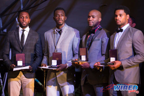 Photo: Trinidad and Tobago's 4x100 metre relay team of (from left) Richard Thompson, Marc Burns, Emmanuel Callender and Keston Bledman pose with their London 2012 Olympic Games silver medals in a ceremony at the Anchorage, Carenage  on 29 June 2016. (Courtesy Allan V Crane/CA Images/Wired868)