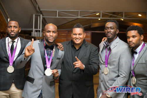 Photo: Trinidad and Tobago's London Olympics 4x100 metre relay team of (from left) Richard Thompson, Emmanuel Callender, Marc Burns and Keston Bledman pose with Sport Minister Darryl Smith (centre) in a ceremony at The Anchorage, Carenage  on 29 June 2016. (Courtesy Allan V Crane/CA Images/Wired868)