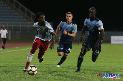 Photo: Central FC forward Jason Marcano (left) outpaces Vancouver Whitecaps defenders Brett Levis (centre) and captain Pa-Modou Kah during CONCACAF Champions League action on 2 August 2016. The Whitecaps won 1-0. (Courtesy Chevaughn Christopher/Wired868)