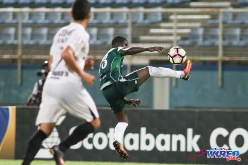 Photo: W Connection captain Hughton Hector (right) controls the ball during CONCACAF Champions League action at the Ato Boldon Stadium, Couva on 25 August 2016. (Courtesy Chevaughn Christopher/Wired868)