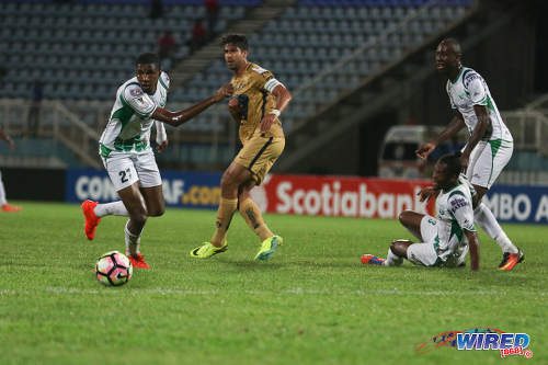 Photo: W Connection players (from left) Jelani Peters, Gerrard Williams and Daneil Cyrus keep their eyes on the ball while Pumas UNAM captain Eduardo Herrera watches on during CONCACAF Champions League action in Couva on 3 August 2016. Pumas won 4-2. (Courtesy Chevaughn Christopher/Wired868)