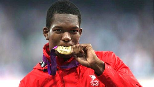 Photo: Trinidad and Tobago javelin thrower Keshorn Walcott plays with his gold medal at the London 2012 Olympic Games.