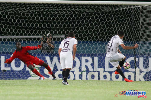 Photo: Honduras Progreso striker Angel Tejada (right) converts his penalty past W Connection goalkeeper Julani Archibald during CONCACAF Champions League action at the Ato Boldon Stadium, Couva on 25 August 2016. Connection and Progreso played to a 1-1 draw. (Courtesy Chevaughn Christopher/Wired868)