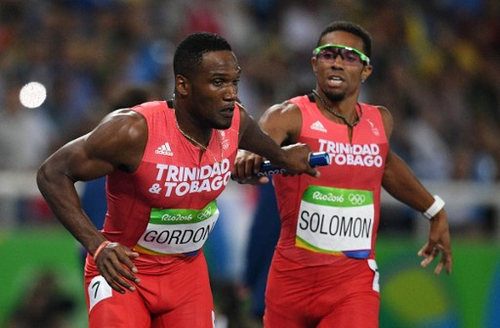 Photo: Trinidad and Tobago’s Lalonde Gordon (left) receives the baton from Jarrin Solomon during the men’s 4x400m relay heat at the Rio 2016 Olympic Games on 19 August 2016. (Copyright Johannes Eisele/AFP 2016/Wired868)