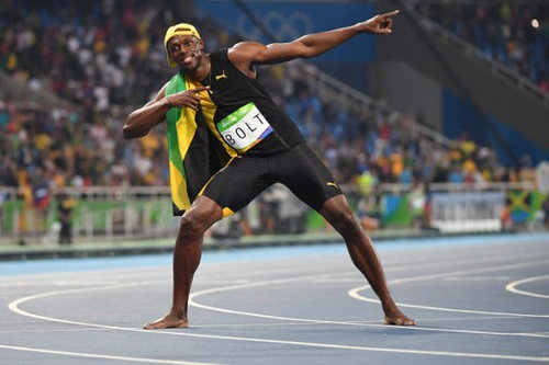 Photo: Jamaica's Usain Bolt celebrates after winning the 100 metre Olympic final for a record third successive time at the Rio 2016 Olympic Games on 14 August 2016.  (Copyright AFP 2016/Wired868)