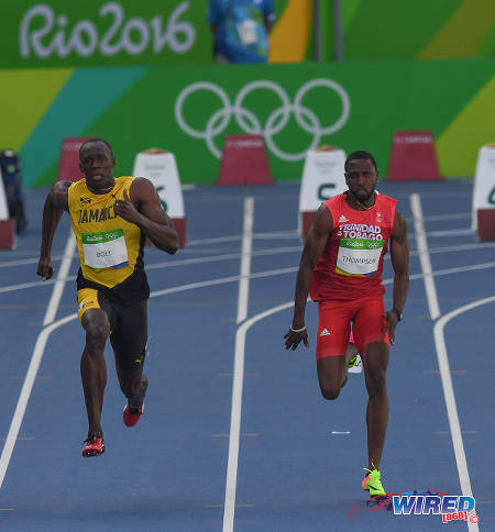 Photo: Trinidad and Tobago's Richard Thompson (right) tries unsuccessfully to hold off Jamaica legend Usain Bolt in the first round of the 100 metre event at the Rio Olympics on 13 August 2016. (Courtesy Sean Morrison/Wired868)