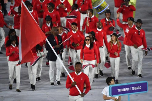 Photo: Trinidad and Tobago’s flagbearer Keshorn Walcott leads his delegation during the opening ceremony of the Rio 2016 Olympic Games at the Maracana stadium in Rio de Janeiro on 5 August 2016.  But Mr Live Wire will start a petition for Fay-Ann Lyons-Alvarez to carry the flag in 2020. (Copyright Pedro Ugarte/AFP 2016/Wired868)