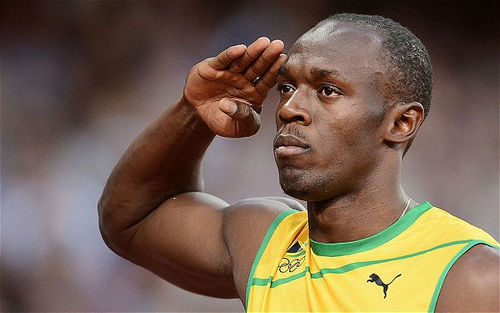 Photo: Jamaica sprint sensation Usain Bolt salutes the crowd. (Copyright UK Telegraph)