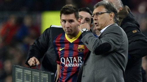 Photo: Then Barcelona coach Gerald "Tata" Martino (right) passes on instructions to five time World Player of the Year Lionel Messi. (Copyright EPA)