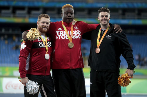 Photo: Trinidad and Tobago's javelin gold medalist Akeem Stewart (centre) shares the podium with Canada’s Alister McQueen (left) and New Zealand’s Rory McSweeny during the Rio 2016 Paralympic Games on 9 September 2016. (Copyright Alexandre Loureiro/Getty Images)