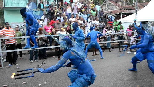 Photo: Blue Devils prance during the 2013 Carnival season.