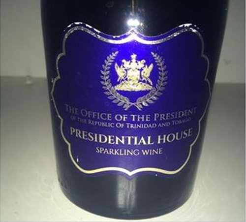 Photo: Wine to the side! A curious label on a bottle of wine has raised questions for President Anthony Carmona. (Courtesy Rhoda Bharath)