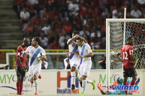 Photo: Guatemala captain Carlos Ruiz (second from left) and his teammates celebrate one of his two goals against Trinidad and Tobago at the Hasely Crawford Stadium in Port of Spain on Friday 2 September 2016. (Courtesy Allan V Crane/Wired868)