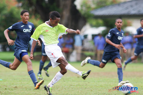 Photo: St Augustine midfielder Akeem Hosten (centre) drives the ball while QRC players T’Shad Selvon (right) and Kalev Keil look on during SSFL Premier Division action at the QRC grounds on 8 September 2016. (Courtesy Chevaughn Christopher/Wired868)