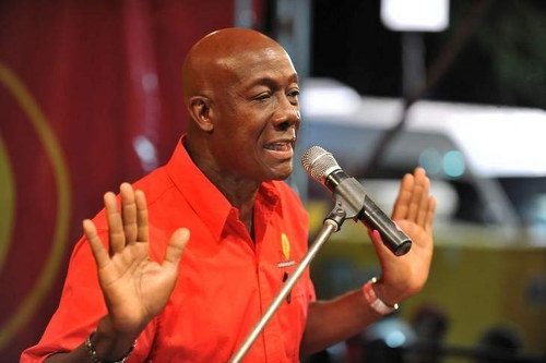 Photo: Prime Minister Dr Keith Rowley gestures on the election campaign platform. Is he saying that he did nothing wrong? (Courtesy Caribbean News Service)