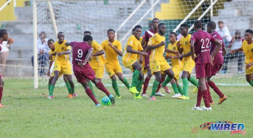 Photo: East Mucurapo substitute Jelani Ferary (#9) tries to drive his shot past the entire Signal Hill squad during SSFL Premier Division action at Moka on 14 September 2016. Signal Hill held on for a 2-1 win. (Courtesy Sean Morrison/Wired868)