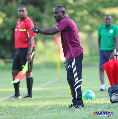 Photo: East Mucurapo Secondary coach Dale Saunders (centre) gives instructions during SSFL Premier Division action against Signal Hill at Moka on 14 September 2016. Signal Hill won 2-1. (Courtesy Sean Morrison/Wired868)