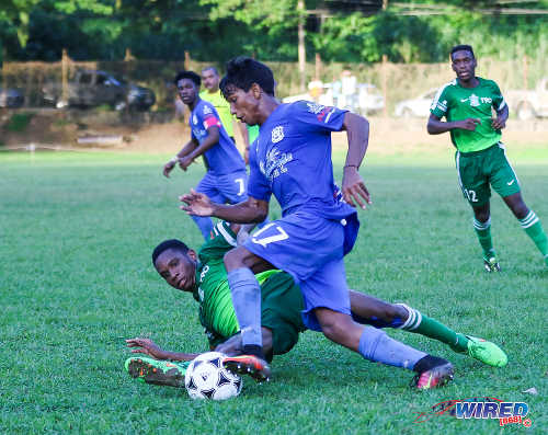 Photo: Naparima College attacker Mark Ramdeen (centre) dribbles past a Trinity College Moka opponent during SSFL Premier Division action on 21 September 2016 at Moka. (Courtesy Sean Morrison/Wired868)