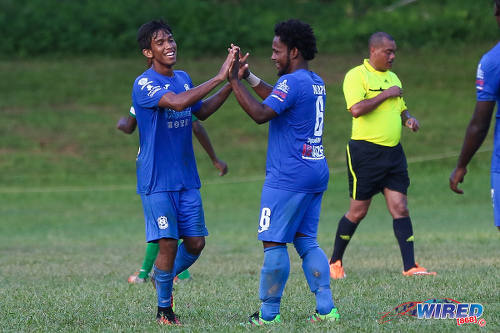 Photo: Naparima College goal scorer Mark Ramdeen (left) is congratulated by midfielder Judah St Louis during SSFL Premier Division action against Trinity College Moka on 21 September 2016 at Moka. (Courtesy Sean Morrison/Wired868)