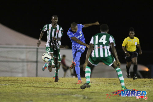 Photo: Naparima College midfielder Renaldo Francois (centre) goes for goal during SSFL Premier Division action against San Juan North at Irwin Park, Siparia on 7 September 2016. Both teams played to a 2-2 draw. (Courtesy Chevaughn Christopher/Wired868)