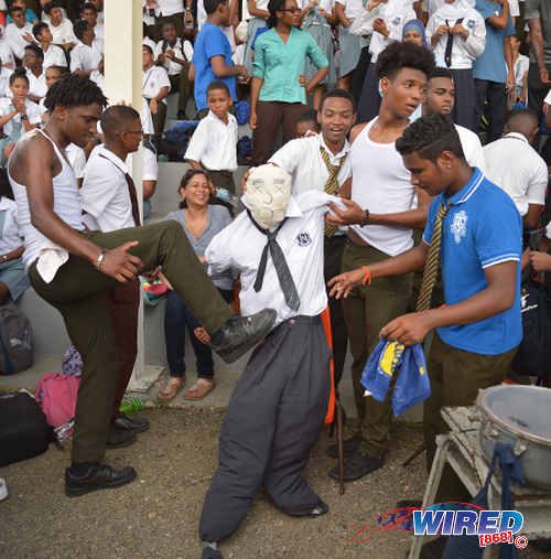 Photo: Presentation College (San Fernando) supporters pick on a dummy during their SSFL Premier Division clash with rivals Naparima College at Lewis Street, San Fernando on 28 September 2016. (Courtesy Allan V Crane/Wired868)