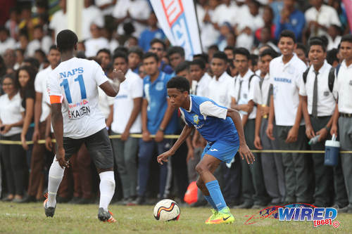 Photo: Presentation College (San Fernando) winger Jordan Riley (right) takes on Naparima College midfielder Shane Sandy during SSFL Premier Division action at Lewis Street, San Fernando on 28 September 2016. (Courtesy Allan V Crane/Wired868)