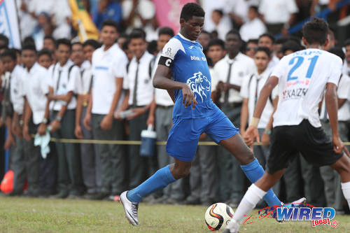 Photo: Presentation College (San Fernando) playmaker Kareem Riley (left) sizes up Naparima College flanker Justin Sadoo during SSFL Premier Division action at Lewis Street, San Fernando on 28 September 2016. (Courtesy Allan V Crane/Wired868)