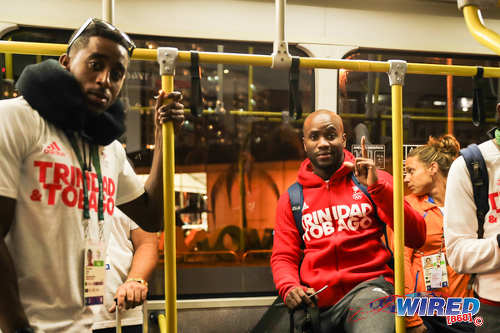 Photo: Trinidad and Tobago Olympians Jehue Gordon (left) and Emmanuel Callender catch the bus during the Rio 2106 Olympic Games. (Courtesy Allan V Crane/Wired868)