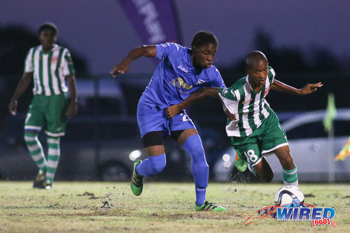 Photo: San Juan North midfielder Tigana O’Brien (right) holds off Naparima College defender Sylon Sylvan during SSFL Premier Division action at Irwin Park, Siparia on 7 September 2016. Both teams played to a 2-2 draw. (Courtesy Chevaughn Christopher/Wired868)