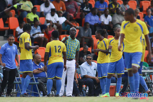 Photo: Shiva Boys HC coach Hayden Ryan (centre) passes instructions to his team during SSFL Premier Division action at Irwin Park, Siparia on 7 September 2016. Shiva Boys whipped Presentation College 3-1. (Courtesy Chevaughn Christopher/Wired868)