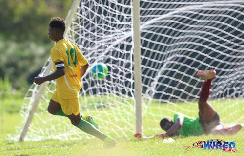 Photo: Signal Hill Secondary captain Akiel Frank (left) peels off to celebrate after beating East Mucurapo Secondary goalkeeper Joshua Davis during SSFL Premier Division action at Moka on 14 September 2016. Signal Hill won 2-1. (Courtesy Sean Morrison/Wired868)