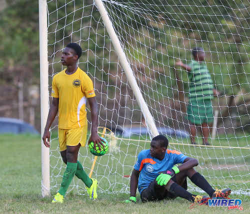 Photo: Signal Hill goalkeeper Joshua James (right) looks dejected while his defender removes the ball after a controversial penalty kick by East Mucurapo during SSFL Premier Division action at Moka on 14 September 2016. Signal Hill won 2-1. (Courtesy Sean Morrison/Wired868)