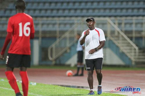 Photo: Trinidad and Tobago National Under-17 Team coach Russell Latapy (right) passes on instructions to midfielder Nickel Orr during Caribbean Football Union (CFU) action against Jamaica on 20 September 2016 at the Ato Boldon Stadium in Couva. (Courtesy Chevaughn Christopher/Wired868)