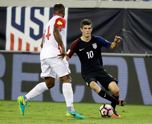 Photo: Seventeen-year-old United States midfielder Christian Pulisic (right) takes on Trinidad and Tobago midfielder Andre Boucaud during FIFA 2018 World Cup qualifying action at the EverBank Field on 6 September 2016 in Jacksonville, Florida. (Copyright John Raoux/AP)