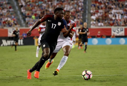 Photo: United States forward Jozy Altidore (left) tries to escape from Trinidad and Tobago defender Carlyle Mitchell during FIFA 2018 World Cup qualifying action at the EverBank Field on 6 September 2016 in Jacksonville, Florida. (Copyright Sam Greenwood/Getty Images/AFP)