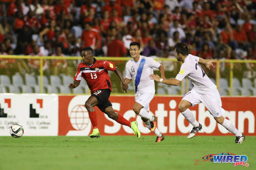 Photo: Trinidad and Tobago winger Cordell Cato (left) sprints past Guatemala left back Rafael Morales (centre) and midfielder Rodrigo Saravia during 2018 World Cup qualifying action at the Hasely Crawford Stadium, Port of Spain on 2 September 2016. Trinidad and Tobago and Guatemala played to a 2-2 draw. (Courtesy Chevaughn Christopher/Wired868)