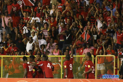 Photo: Trinidad and Tobago midfielder Khaleem Hyland (second from right) gestures to fans after Joevin Jones' second goal against Guatemala during Russia 2018 World Cup qualifying action at the Hasely Crawford Stadium in Port of Spain on Friday 2 September 2016. Both teams played to a 2-2 draw. (Courtesy Chevaughn Christopher/Wired868