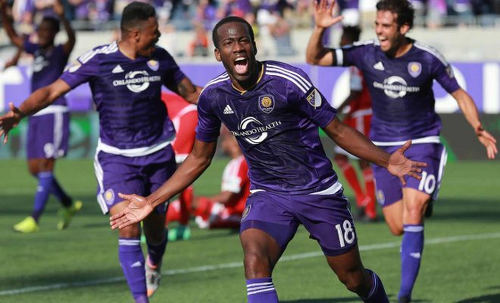 Photo: Orland City midfielder Kevin Molino (centre) celebrates a goal during MLS competition. (Copyright MLS Futbol)