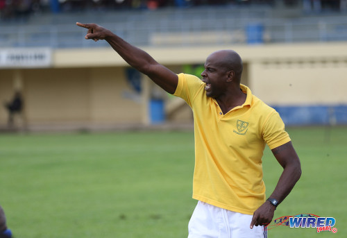 Photo: St Benedict's College coach Leonson Lewis points the way forward for his team during SSFL Premier Division action against East Mucurapo at Mucurapo Road on 6 October 2016. (Courtesy Sean Morrison/Wired868)