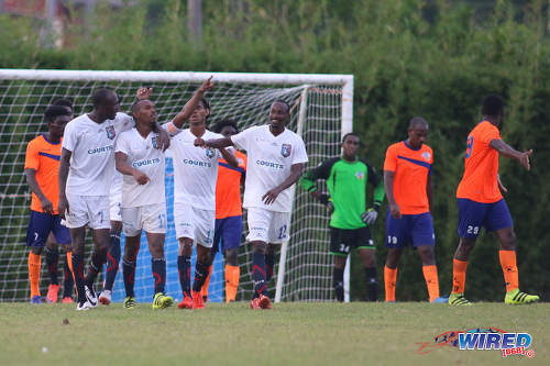 Photo: Morvant Caledonia United players (from right) Kareem Joseph, Lester Joseph, Akim Armstrong and Kordell Samuel celebrate after a goal against Club Sando during Pro League action on 30 October 2016 at Mahaica Oval. (Courtesy Chevaughn Christopher/Wired868)