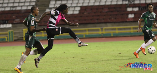 Photo: Central FC attacker Jason Marcano (centre) goes for goal during 2016/17 Pro League action against W Connection at the Hasely Crawford Stadium in Port of Spain on 4 October 2016. Looking on are Connection players Briel Thomas (left) and Maurice Ford. (Courtesy Sean Morrison/Wired868)