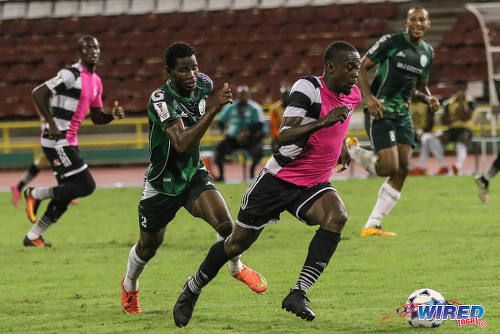 Photo: Central FC attacker Marcus Joseph (right) tries to pull away from W Connection winger Kurt Frederick during 2016/17 Pro League action at the Hasely Crawford Stadium in Port of Spain on 4 October 2016. (Courtesy Sean Morrison/Wired868)