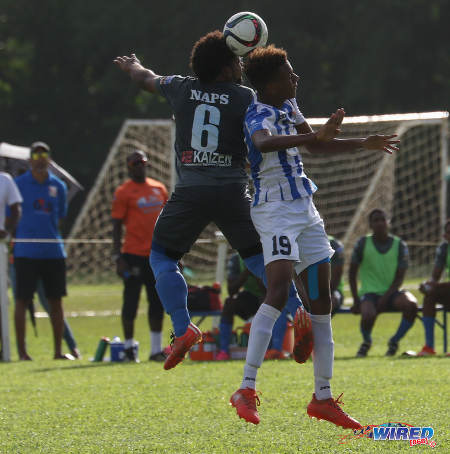 Photo: St Mary's College striker Trey La Motte (right) is challenged in the air by Naparima College midfielder Judah St Louis during SSFL Premier Division action at Serpentine Road on 8 October 2016. (Courtesy Sean Morrison/Wired868)