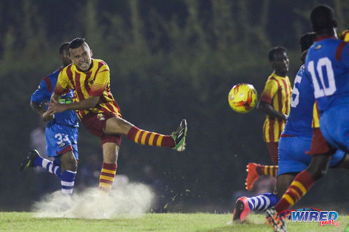 Photo: Point Fortin Civic forward and new Venezuelan signing Jose Herrera (left) goes for goal during Pro League action against St Ann's Rangers on 30 October 2016 at Mahaica Oval. (Courtesy Chevaughn Christopher/Wired868)