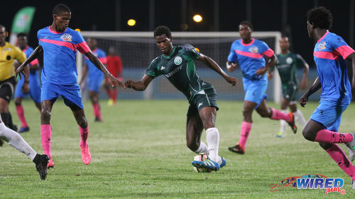 Photo: W Connection flanker Kurt Frederick (centre) finds space to operate between three Club Sando opponents during Pro League action at the Ato Boldon Stadium in Couva on 14 October 2016. (Courtesy Sean Morrison/Wired868)