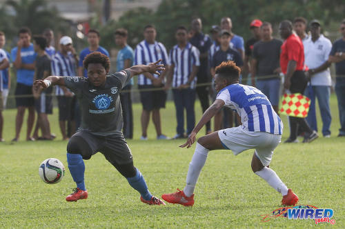 Photo: Naparima College midfielder Judah St Louis (left) takes on St Mary's College forward Trey La Motte during SSFL Premier Division action at Serpentine Road on 8 October 2016. (Courtesy Sean Morrison/Wired868)