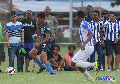 Photo: Naparima College midfielder Justin Sadoo (left) races down the byline during SSFL Premier Division action against St Mary's College at Serpentine Road on 8 October 2016. (Courtesy Sean Morrison/Wired868)